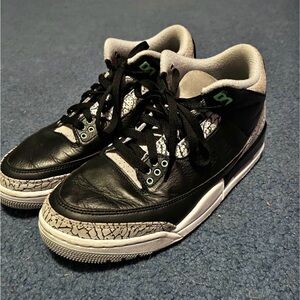 Black and Gray Sneakers with Green Accents